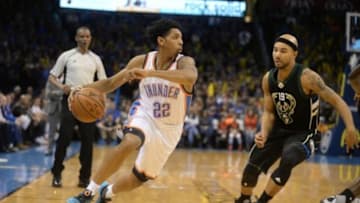Dec 29, 2015; Oklahoma City, OK, USA; Oklahoma City Thunder guard Cameron Payne (22) drives to the basket against Milwaukee Bucks guard Jerryd Bayless (19) during the fourth quarter at Chesapeake Energy Arena. Mandatory Credit: Mark D. Smith-USA TODAY Sports