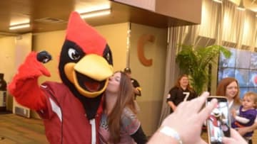 Jan 26, 2015; Phoenix, AZ, USA; Arizona Cardinals mascot Big Red (L) poses with Kelly Krieger (R) during NFL Experience at the Phoenix Convention Center. Mandatory Credit: Kirby Lee-USA TODAY Sports