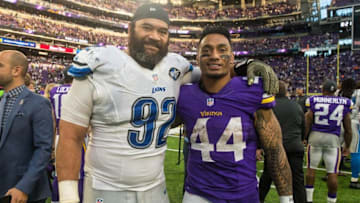 Nov 6, 2016; Minneapolis, MN, USA; Detroit Lions defensive tackle Haloti Ngata (92) and Minnesota Vikings running back Matt Asiata (44) pose for a photo following the game at U.S. Bank Stadium. The Lions defeated the Vikings 22-16. Mandatory Credit: Brace Hemmelgarn-USA TODAY Sports