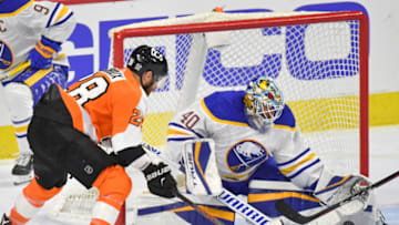Jan 18, 2021; Philadelphia, Pennsylvania, USA; Buffalo Sabres goaltender Carter Hutton (40) makes a save against Philadelphia Flyers center Claude Giroux (28) during the third period at Wells Fargo Center. Mandatory Credit: Eric Hartline-USA TODAY Sports