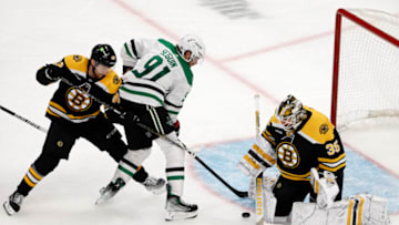 Oct 25, 2022; Boston, Massachusetts, USA; Boston Bruins defenseman Matt Grzelcyk (48) tries to keep Dallas Stars center Tyler Seguin (91) from a rebound in front of goaltender Linus Ullmark (35) during the second period at TD Garden. Mandatory Credit: Winslow Townson-USA TODAY Sports