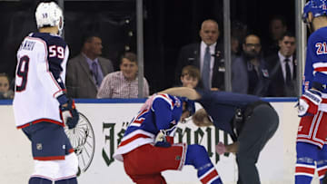 NEW YORK, NEW YORK - OCTOBER 23: Filip Chytil #72 of the New York Rangers is injured and attended to by trainer Jim Ramsey during the first period against the Columbus Blue Jackets at Madison Square Garden on October 23, 2022 in New York City. (Photo by Bruce Bennett/Getty Images)