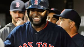 Sep 20, 2014; Baltimore, MD, USA; Boston Red Sox designated hitter David Ortiz (34) reacts in the dugout after hitting a two-run home run in the first inning against the Baltimore Orioles at Oriole Park at Camden Yards. Mandatory Credit: Joy R. Absalon-USA TODAY Sports