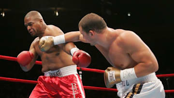 NEW YORK - JUNE 10: (R-L) Tom Zbikowski makes contact with Robert Bell during their Heavyweight bout on June 10, 2006 at Madison Square Garden in New York City. (Photo by Nick Laham/Getty Images)