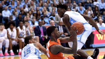 CHAPEL HILL, NORTH CAROLINA - FEBRUARY 26: Frank Howard #23 of the Syracuse Orange battles Garrison Brooks #15 and Nassir Little #5 of the North Carolina Tar Heels for a loose ball during the first half of their game at the Dean Smith Center on February 26, 2019 in Chapel Hill, North Carolina. (Photo by Grant Halverson/Getty Images)