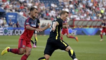 Jul 26, 2014; Bridgeview, IL, USA; Tottenham Hotspur forward Harry Kane (37) dribbles around Chicago Fire defender Patrick Ianni (6) during a friendly at Toyota Park. Mandatory Credit: Jon Durr-USA TODAY Sports