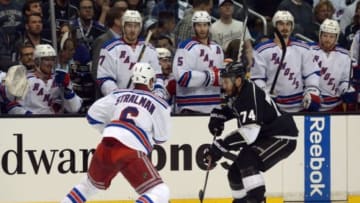 Jun 4, 2014; Los Angeles, CA, USA; Los Angeles Kings left wing Dwight King (74) controls the puck against New York Rangers defenseman Anton Stralman (6) in the third period during game one of the 2014 Stanley Cup Final at Staples Center. Mandatory Credit: Kirby Lee-USA TODAY Sports