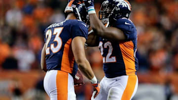 Oct 24, 2016; Denver, CO, USA; Denver Broncos running back Devontae Booker (23) celebrates with running back C.J. Anderson (22) after scoring a touchdown in the fourth quarter against the Houston Texans at Sports Authority Field at Mile High. The Broncos won 27-9. Mandatory Credit: Isaiah J. Downing-USA TODAY Sports