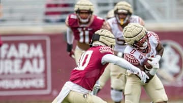 Florida State Seminoles running back Jashaun Corbin (0) tries to doge a defender. The Florida State Seminoles hosted a limited number of fans for the Garnet and Gold Spring Game Saturday, April 10, 2021.Garnet And Gold Edits033