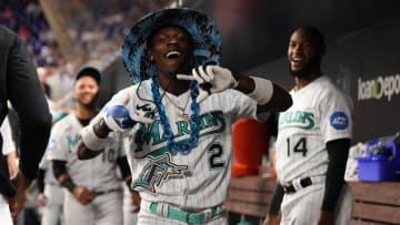 MIAMI, FL - MAY 12: Jazz Chisholm Jr. #2 of the Miami Marlins celebrates with teammates in the dugout after hitting a solo home-run in the game against the Cincinnati Reds at loanDepot park on May 12, 2023 in Miami, Florida. (Jasen Vinlove/Miami Marlins/Getty Images)