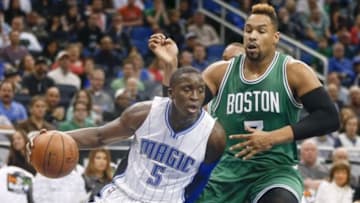 Jan 31, 2016; Orlando, FL, USA;Orlando Magic guard Victor Oladipo (5) drives around Boston Celtics center Jared Sullinger (7) during the first quarter of a basketball game at Amway Center. Mandatory Credit: Reinhold Matay-USA TODAY Sports