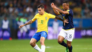 PORTO ALEGRE, BRAZIL - AUGUST 31: Philippe Coutinho (L) of Brazil struggles for the ball with Pedro Quinonez of Ecuador during a match between Brazil and Ecuador as part of 2018 FIFA World Cup Russia Qualifier at Arena do Gremio on August 31, 2017 in Porto Alegre, Brazil. (Photo by Buda Mendes/Getty Images)