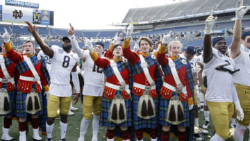 ORLANDO, FL - DECEMBER 28: Notre Dame Fighting Irish celebrate with the band following the Camping World Bowl against the Iowa State Cyclones at Camping World Stadium on December 28, 2019 in Orlando, Florida. Notre Dame defeated Iowa State 33-9. (Photo by Joe Robbins/Getty Images)