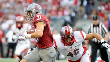 Aug 28, 2014; Seattle, WA, USA; Washington State Cougars wide receiver River Cracraft (21) is brought down by Rutgers Scarlet Knights linebacker Kevin Snyder (45) during the first half at Centurylink Field. Mandatory Credit: James Snook-USA TODAY Sports
