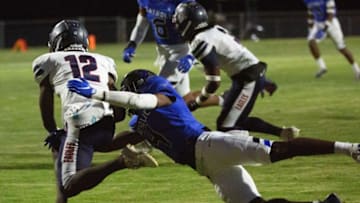 Catholic's Jourdan Thomas (4) takes down Montgomery Academy's Chance Wilson (12) in the first half on September 24, 2021.092421 Ma Vs Catholic