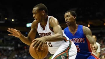 Jan 24, 2015; Milwaukee, WI, USA; Milwaukee Bucks guard Khris Middleton (22) drives past Detroit Pistons guard Kentavious Caldwell-Pope (5) in the third quarter at BMO Harris Bradley Center. Mandatory Credit: Benny Sieu-USA TODAY Sports