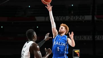 Italy's Niccolo Mannion (R) jumps for the ball in the men's preliminary round group B basketball match between Germany and Italy during the Tokyo 2020 Olympic Games at the Saitama Super Arena in Saitama on July 25, 2021. (Photo by Aris MESSINIS / AFP) (Photo by ARIS MESSINIS/AFP via Getty Images)