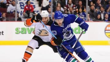 Nov 20, 2014; Vancouver, British Columbia, CAN; Anaheim Ducks defenseman Clayton Stoner (3) defends against Vancouver Canucks forward Linden Vey (7) during the first period at Rogers Arena. Mandatory Credit: Anne-Marie Sorvin-USA TODAY Sports