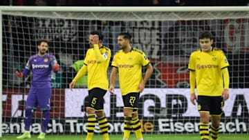 (L-R) Dortmund's Swiss goalkeeper Roman Buerki, Dortmund's German defender Mats Hummels, Dortmund's German midfielder Emre Can and Dortmund's US midfielder Giovanni Reyna react during the German first division Bundesliga football match Bayer Leverkusen v Borussia Dortmund in Leverkusen, western Germany on February 8, 2020. (Photo by INA FASSBENDER / AFP) / RESTRICTIONS: DFL REGULATIONS PROHIBIT ANY USE OF PHOTOGRAPHS AS IMAGE SEQUENCES AND/OR QUASI-VIDEO (Photo by INA FASSBENDER/AFP via Getty Images)