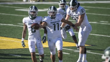 ANN ARBOR, MI - OCTOBER 31: Connor Heyward #11 of the Michigan State Spartans celebrates after receiving an onside kick during the fourth quarter against the Michigan Wolverines at Michigan Stadium on October 31, 2020 in Ann Arbor, Michigan. (Photo by Nic Antaya/Getty Images)