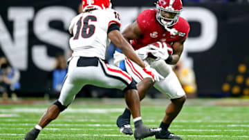 Jan 10, 2022; Indianapolis, IN, USA; Alabama Crimson Tide running back Brian Robinson Jr. (4) runs the ball against Georgia Bulldogs defensive back Lewis Cine (16) during the third quarter in the 2022 CFP college football national championship game at Lucas Oil Stadium. Mandatory Credit: Mark J. Rebilas-USA TODAY Sports