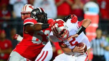 Sep 28, 2013; Columbus, OH, USA; Wisconsin Badgers quarterback Joel Stave (2) is sacked by Ohio State Buckeyes defensive lineman Michael Bennett (63) during the third quarter at Ohio Stadium. Mandatory Credit: Andrew Weber-USA TODAY Sports