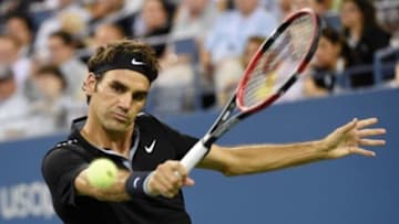 Sep 4, 2014; New York, NY, USA; Roger Federer (SUI) returns a shot to Gael Monfils (FRA) on day eleven of the 2014 U.S. Open tennis tournament at USTA Billie Jean King National Tennis Center. Mandatory Credit: Robert Deutsch-USA TODAY Sports