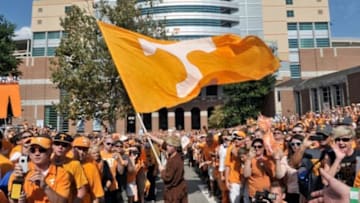 Sep 15, 2012; Knoxville, TN, USA; Tennessee Volunteers pioneer mascot flag bearer waves the flag during the Vol Walk outside Neyland Stadium prior to the game against the Florida Gators. Mandatory Credit: Jim Brown-USA TODAY Sports