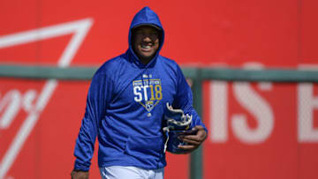 SURPRISE, AZ - FEBRUARY 24: Salvador Perez #13 of the Kansas City Royals smiles while walking out to the field for the MLB game against the Los Angeles Dodgers at Surprise Stadium on February 24, 2018 in Surprise, Arizona. (Photo by Jennifer Stewart/Getty Images)
