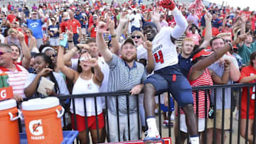 Sep 3, 2016; Starkville, MS, USA;South Alabama Jaguars defensive end Jaylan Daniels (4) celebrates with fans after the game against the Mississippi State Bulldogs at Davis Wade Stadium. South Alabama won 21-20. Mandatory Credit: Matt Bush-USA TODAY Sports