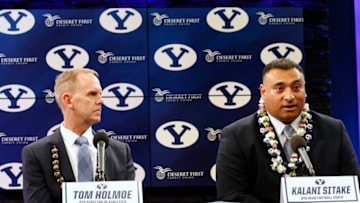 PROVO, UT - DECEMBER 21: Brigham Young University Athletic Director Tom Holme, (L) listens to BYU's new head football coach, Kalani Sitake, (R), at a press conference on December 21, 2015 in Provo, Utah. Stake who played for BYU in the 90's will become BYU's 13 head coach. (Photo by George Frey/Getty Images)