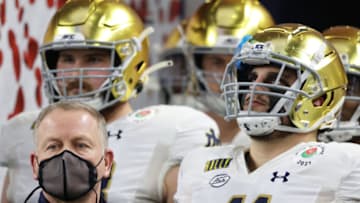 ARLINGTON, TEXAS - JANUARY 01: Head coach Brian Kelly of the Notre Dame Fighting Irish and team take the field for the 2021 College Football Playoff Semifinal Game at the Rose Bowl Game presented by Capital One against the Alabama Crimson Tide at AT&T Stadium on January 01, 2021 in Arlington, Texas. (Photo by Ronald Martinez/Getty Images)
