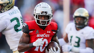 Cincinnati Bearcats running back Charles McClelland runs the ball against South Florida Bulls at Nippert Stadium. USA Today.