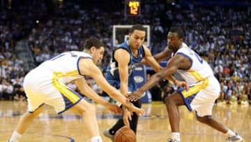Apr 14, 2014; Oakland, CA, USA; Golden State Warriors guard Klay Thompson (11) and forward Harrison Barnes (40) combine to steal the ball against Minnesota Timberwolves guard Kevin Martin (23) during the second quarter at Oracle Arena. Mandatory Credit: Kelley L Cox-USA TODAY Sports