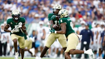 Sep 3, 2022; Tampa, Florida, USA; South Florida Bulls quarterback Gerry Bohanon (11) hands the ball off to running back Jaren Mangham (0) against the Brigham Young Cougars during the first half at Raymond James Stadium. Mandatory Credit: Douglas DeFelice-USA TODAY Sports