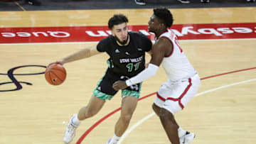 Jan 23, 2021; Queens, New York, USA; Utah Valley Wolverines center Fardaws Aimaq (11) is guarded by St. John’s Red Storm forward Marcellus Earlington (10) in the first half at Carnesecca Arena. Mandatory Credit: Wendell Cruz-USA TODAY Sports