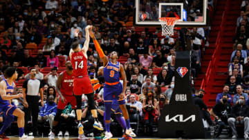 Tyler Herro #14 of the Miami Heat shoots against RJ Barrett #9 of the New York Knicks (Photo by Cliff Hawkins/Getty Images)