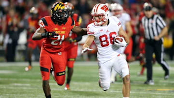 Nov 7, 2015; College Park, MD, USA; Wisconsin Badgers wide receiver Alex Erickson (86) gains yards after his catch defended by Maryland Terrapins defensive back Sean Davis (21) at Byrd Stadium. Mandatory Credit: Mitch Stringer-USA TODAY Sports