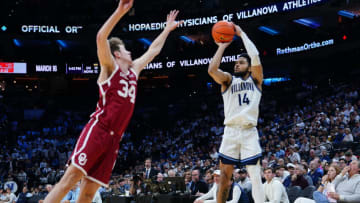 Dec 3, 2022; Philadelphia, Pennsylvania, USA; Villanova Wildcats guard Caleb Daniels (14) shoots a three point jump shot against Oklahoma Sooners forward Jacob Groves (34) during the second half at Wells Fargo Center. Mandatory Credit: Gregory Fisher-USA TODAY Sports