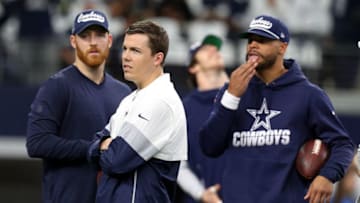 ARLINGTON, TEXAS - DECEMBER 29: Kellen Moore (center) with Cooper Rush and Dak Prescott of the Dallas Cowboys (Photo by Richard Rodriguez/Getty Images)