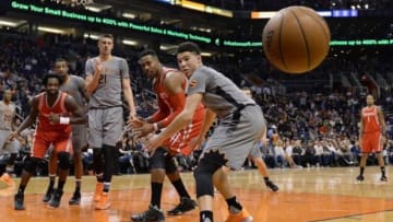 Feb 4, 2016; Phoenix, AZ, USA; Houston Rockets guard Patrick Beverley (left), Phoenix Suns center Alex Len (21), Houston Rockets center Dwight Howard (12) and Phoenix Suns guard Devin Booker (1) watch the loose ball in the game at Talking Stick Resort Arena. Mandatory Credit: Jennifer Stewart-USA TODAY Sports