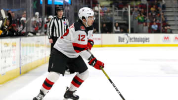 CLEVELAND, OH - FEBRUARY 09: Binghamton Devils right wing Nick Merkley (12) controls the puck during the first period of the American Hockey League game between the Binghamton Devils and Cleveland Monsters on February 9,2020, at Rocket Mortgage FieldHouse in Cleveland, OH. (Photo by Frank Jansky/Icon Sportswire via Getty Images)
