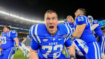 Dec 26, 2015; Bronx, NY, USA; Duke Blue Devils guard Jake Sanders (72) celebrates after the 2015 New Era Pinstripe Bowl against the Indiana Hoosiers at Yankee Stadium. The Blue Devils won 44-41 in overtime. Mandatory Credit: Vincent Carchietta-USA TODAY Sports
