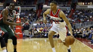 Dec 6, 2013; Washington, DC, USA; Washington Wizards small forward Otto Porter Jr. (22) dribbles the ball as Milwaukee Bucks power forward Ekpe Udoh (5) defends in the second quarter at Verizon Center. Mandatory Credit: Geoff Burke-USA TODAY Sports