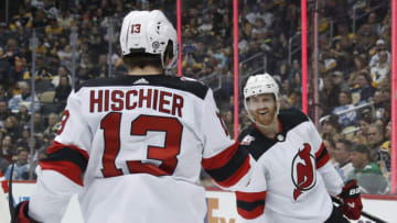 Feb 18, 2023; Pittsburgh, Pennsylvania, USA; New Jersey Devils defenseman Dougie Hamilton (7) reacts with center Nico Hischier (13) after Hamilton scored a goal against the Pittsburgh Penguins during the second period at PPG Paints Arena. Mandatory Credit: Charles LeClaire-USA TODAY Sports