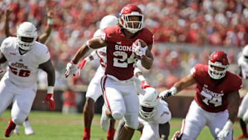 NORMAN, OK - SEPTEMBER 01: Running back Rodney Anderson #24 of the Oklahoma Sooners breaks through the Florida Atlantic Owls defense at Gaylord Family Oklahoma Memorial Stadium on September 1, 2018 in Norman, Oklahoma. The Sooners defeated the Owls 63-14. (Photo by Brett Deering/Getty Images)