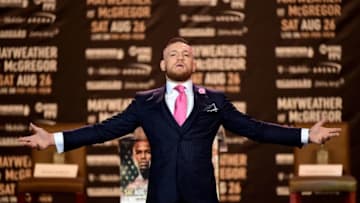LOS ANGELES, CA - JULY 11: Conor McGregor poses on stage as he is introduced for the Floyd Mayweather Jr. v Conor McGregor World Press Tour at Staples Center on July 11, 2017 in Los Angeles, California. (Photo by Harry How/Getty Images)