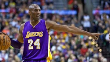 Jan 23, 2016; Portland, OR, USA; Los Angeles Lakers forward Kobe Bryant (24) points towards Portland Trail Blazers guard Damian Lillard (0) during the first quarter at the Moda Center. Mandatory Credit: Craig Mitchelldyer-USA TODAY Sports