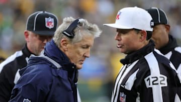 GREEN BAY, WISCONSIN - NOVEMBER 14: Head Coach Pete Carroll speaks with officials during the first quarter against the Green Bay Packers at Lambeau Field on November 14, 2021 in Green Bay, Wisconsin. (Photo by Stacy Revere/Getty Images)
