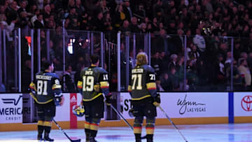 LAS VEGAS, NV - FEBRUARY 23: Jonathan Marchessault #81, Reilly Smith #19 and William Karlsson #71 of the Vegas Golden Knights stand on the ice as the Canadian and American national anthems are performed before the team's game against the Vancouver Canucks at T-Mobile Arena on February 23, 2018 in Las Vegas, Nevada. The Golden Knights won 6-3. (Photo by Ethan Miller/Getty Images)